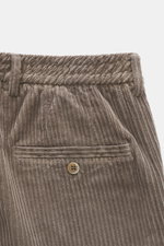 Close-up front view of GTA Corduroy Pants 'Davide' taupe, corduroy made of cotton with elastic quality, smooth touch, regular fit, slightly tapered, zipper and waistband button, internal elastic band, French pockets, small logo detail, and back pockets wi