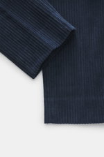 Close-up front view of navy corduroy fabric on GTA Corduroy Pants 'Davide' navy, showing cotton material with elastic quality, smooth touch, regular fit, slightly tapered, zipper and waistband button, internal elastic band, French pockets, small logo deta