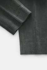 Close-up top-down view of GTA Corduroy Pants 'Davide' dark grey fabric showcasing cotton corduroy, stretch quality, smooth touch, and ribbed texture.