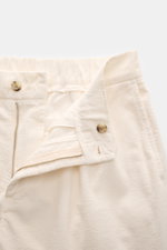 Close-up front top view of 04651/ A trip in a bag Black Corduroy Pants in soft cotton corduroy with zipper, button, and partially elastic waistband.

Description: <p>These corduroy pants by 04651/ A TRIP IN A BAG are made of cotton corduroy with a seers