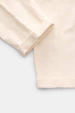 Close-up top-down view of the cuff and lower leg of 04651/ A trip in a bag Black Corduroy Pants in soft cotton corduroy with seersucker backside, slim fit, ankle length, slightly tapered, featuring a fixed hem cuff.