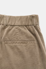 Close-up back view of 04651/ A trip in a bag Corduroy Pants brown showing soft cotton corduroy, partially elastic waistband, welt pocket, and double waistband pleat.

<p>These corduroy pants by 04651/ A TRIP IN A BAG are made of cotton corduroy with a s