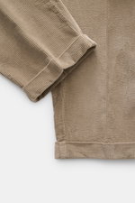 Close-up top-down view of the cuff and fabric texture of 04651/ A trip in a bag Corduroy Pants brown, made of soft cotton corduroy with seersucker inside for comfort.