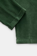 Green corduroy fabric close-up showing a folded cuff and texture from a top-down perspective, highlighting 04651/ A trip in a bag Corduroy Pants Cream.

<p>These corduroy pants by 04651/ A TRIP IN A BAG are made of cotton corduroy with a seersucker back
