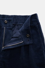 Close-up front view of 04651/ A trip in a bag Corduroy pants navy showing soft wide cotton corduroy texture, zipper, button, and seersucker inside for comfort.