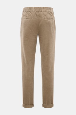 Rear view of 04651/ A trip in a bag Corduroy pants taupe made of wide cotton corduroy with seersucker backing, soft feel, regular fit, tapered legs, zipper and waistband button, partially elastic waistband, side seam pockets, double waistband pleat, welt 