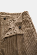 Close-up front view of 04651/ A trip in a bag Corduroy pants taupe showing zipper, waistband button, and soft wide cotton corduroy fabric.

Description: <p>These corduroy pants by 04651/ A TRIP IN A BAG are made of wide cotton corduroy with a seersucker b