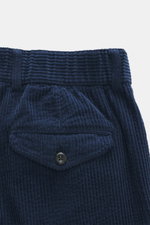 Close-up front view of 04651/ A trip in a bag Corduroy Pants navy showing soft wide cotton corduroy, buttoned flap watch pocket.