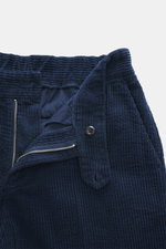 Close-up front view of 04651/ A trip in a bag Corduroy Pants navy showing soft wide cotton corduroy, zipper, button, and seersucker inside for comfort.