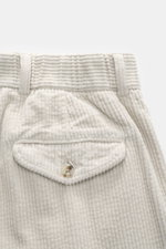 Close-up front top view of 04651/ A trip in a bag Corduroy Pants taupe showing soft cotton corduroy texture and buttoned flap pocket.