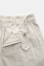 Close-up front view of 04651/ A trip in a bag Corduroy Pants taupe showing soft cotton corduroy fabric, zipper, button, and partially elastic waistband.