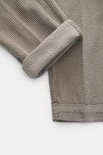 Close-up top view of 04651/ A trip in a bag Corduroy Pants taupe showing soft wide cotton corduroy fabric with seersucker inside cuff for comfort.