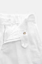 Close-up front view of 04651/ A trip in a bag Corduroy Pants white showing zipper, button, and soft wide cotton corduroy fabric with seersucker inside.

Description: <p>These corduroy pants by 04651/ A TRIP IN A BAG are made from wide cotton corduroy with