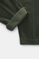 Close-up top-down view of 04651/ A trip in a bag Corduroy Pants dark green showing wide cotton corduroy texture and soft seersucker inside cuff.

<p>These corduroy pants by 04651/ A TRIP IN A BAG are made from wide cotton corduroy with a seersucker back, 