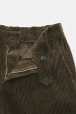 Close-up front view of 04651/ A trip in a bag Corduroy Pants Dark Brown in soft wide cotton corduroy with zipper, button, and seersucker lining.
