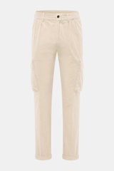 Front view of 04651/ A trip in a bag Cord Cargo Pants Dark Brown in beige corduroy, tapered fit, ankle-length, cargo and side seam pockets, button and zipper.