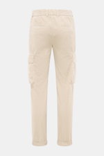 Rear view of 04651/ A trip in a bag Cord Cargo Pants Dark Brown in pure cotton corduroy, tapered fit, ankle-length with cargo and piped back pockets, elastic waistband, and fixed hem cuff, showcasing modern design and highest wearing comfort.