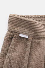 Close-up front view of 04651/ A trip in a bag Cord Cargo Pants Sand, showing soft pure cotton corduroy fabric and waistband.