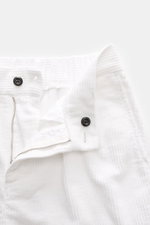 Close-up front view of 04651/ A trip in a bag Cord Cargo Pants White showing zipper, button, waistband in pure cotton corduroy with soft feel, tapered fit, and elastic waistband for highest comfort.