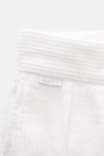 Close-up front view of 04651/ A trip in a bag Cord Cargo Pants White in pure cotton corduroy, showing waistband details with label and soft texture. Modern design, highest wearing comfort: the cargo pants in a casual cut by 04651/ A TRIP IN A BAG made of 