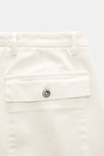 Close-up rear view of Michael Coal Chino 'Work Mc-Louis' cream pants showing patch back pocket with flap, twill cotton fabric, zipper, waistband button, and distinctive weave structure. Slim fit, tapered, ankle-length with fixed hem cuff, garment dyed, Fr