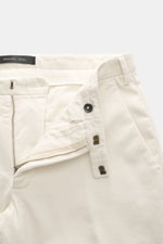 Close-up front view of Michael Coal Cotton Pants cream showing twill cotton fabric with soft touch, zipper and waistband hook, extended button tab, belt loops, tapered fit, regular thigh width, ankle length, narrowing, French pockets, and back pockets wit