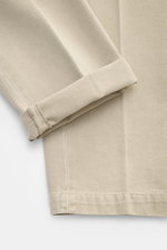 Close-up front view of Michael Coal Cotton Pants Beige showing twill cotton fabric with soft touch, tapered fit, regular thigh width, ankle length narrowing, zipper and waistband hook, extended button tab, French pockets, and back pockets with flap.