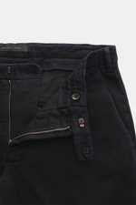 Close-up front view of Michael Coal Cotton Pants navy, showing twill cotton fabric with soft touch, tapered fit, regular thigh width, ankle length, narrowing, zipper and waistband hook, extended button tab, French pockets, and back pockets with flap.