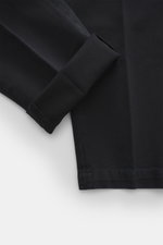 Close-up front view of Michael Coal Cotton Pants navy showing twill cotton fabric with soft touch, tapered fit, regular thigh width, ankle length, narrowing, zipper and waistband hook, extended button tab, French pockets, and back pockets with flap.