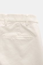 Michael Coal Cotton trousers cream shown from the back waist, twill made of cotton, stretch quality, soft touch, regular fit, very tapered, zipper and waistband button, extended button tab, French pockets, piped back pockets.
