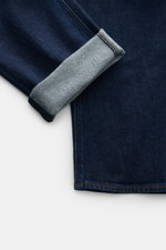 Stone Island Jeans 'Stretch Indigo Denim - Rinsed' dunkelblau, Detailaufnahme Saum und Umschlag, Slim Fit, elastische Baumwolle, Five-Pocket-Stil.