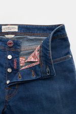 Close-up front view of Jacob Cohen Jeans 'Bard' rauchblau with button fly open, showing elastic cotton denim, soft feel, slim fit, light used wash, and branded details.