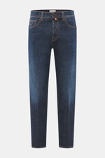 Front view of Jacob Cohen Jeans 'Jude' dark blue in slightly elastic cotton denim with raw design, contrasting seams, button fly, and leather patch.