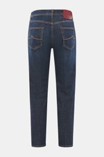 Jacob Cohen Jeans 'Jude' dark blue shown from the back, featuring cotton denim, slightly elastic quality, tapered fit, ankle-length, button fly, five-pocket style with coin pocket and leather patch. With JACOB COHEN, you are always right when it comes to 