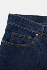 Close-up of Jacob Cohen Jeans 'Jude' navy from the back waist showing slightly elastic cotton denim, contrasting seams, and leather patch.

<p>With JACOB COHEN, you are always right when it comes to modern luxury in everyday life: The premium jeans 'Jude'