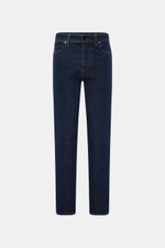 Stone Island Jeans 'Stretch Indigo Denim - Rinsed' dark blue slim fit jeans shown front view, cotton denim with elastic quality, very tapered, compass badge on waistband. Urban classic in a modern silhouette, part of STONE ISLAND's 'Denim' capsule collect