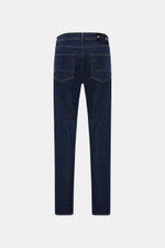 Stone Island Jeans 'Stretch Indigo Denim - Rinsed' dark blue slim fit jeans shown from the back, made of cotton denim with elastic quality, very tapered, featuring two back pockets and a compass badge on the waistband. Urban classic in a modern silhouette