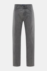 Front view of Stone Island Jeans 'Black Denim - Light Grey Wash' grey, straight fit denim made of pure cotton with subtle used wash, button fly, five-pocket style, and compass badge on waistband, showing typical material texture and straight cut. Denim wi