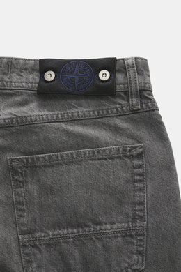Stone Island Jeans 'Black Denim - Light Grey Wash' grey showing close-up of waistband and back pocket from rear top view with compass badge.

<p>Denim with attitude: The 'Black Denim - Light Grey Wash' jeans in straight fit from the 'Denim' capsule collec
