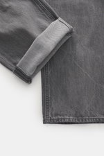 Stone Island Jeans 'Black Denim - Light Grey Wash' grey shown close-up from above, highlighting texture and folded cuff. Denim with attitude: The 'Black Denim - Light Grey Wash' jeans in straight fit from the 'Denim' capsule collection by STONE ISLAND com