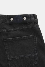 Close-up rear view of Stone Island Jeans 'Black Denim - Medium Grainy Wash' black showing the waistband with compass badge and back pocket.

Description: <p>Denim with attitude: The jeans 'Black Denim - Medium Grainy Wash' in Straight Fit from the 'Denim'