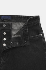 Stone Island Jeans 'Black Denim - Medium Grainy Wash' black shown from a close-up front view, featuring button fly, five-pocket style, straight cut, pure cotton denim with typical material structure, subtle used wash, and compass badge on waistband. Denim