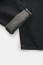 Close-up of Stone Island Jeans 'Black Denim - Medium Grainy Wash' black showing folded cuff with detailed stitching and denim texture, photographed from above.

Additional description: 
<p>Denim with attitude: The jeans 'Black Denim - Medium Grainy Wash' 
