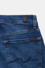 7 for all mankind Jeans 'Slimmy' dunkelblau, Rückansicht mit Weblabel, Five-Pocket Stil, Slim Fit, Baumwolle mit Stretch, Used-Waschung, Zip Fly, leicht schmal zulaufend.