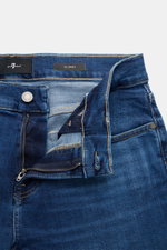 7 for all mankind Jeans 'Slimmy' dunkelblau aus Baumwolle mit Stretch, Slim Fit, Zip Fly, Five-Pocket, Used-Waschung, Detailaufnahme von oben.