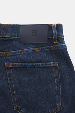 PT Torino Denim Jeans 'Break Beat' navy shown from a close-up rear perspective, highlighting the leather patch, contrast stitching, and five-pocket style. The 'Break Beat' jeans by PT TORINO DENIM combines sturdy, slightly elastic cotton in a regular fit 