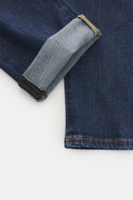 Close-up of the cuff and lower leg of PT Torino Denim Jeans 'Break Beat' navy, photographed from above showing the slightly elastic cotton fabric with subtle used wash, contrast stitching, and textured feel. The jeans feature a regular fit with a very sli