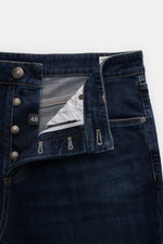 Brunello Cucinelli Jeans 'Leisure Fit' grey blue shown from top front close-up, cotton denim with stretch, button fly, five-pocket style.
