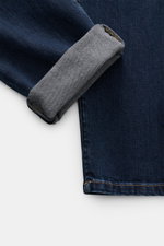 Close-up of Brunello Cucinelli Jeans 'Leisure Fit' grey blue showing folded cuff, detailed denim texture, and stitching from top view.