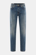 Front view of Incotex Jeans smoky blue made of elastic cotton with slightly grippy texture, authentic wash, slim fit, slightly tapered legs, five-pocket style, button fly, and leather patch.